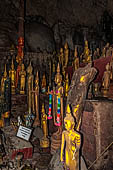 Luang Prabang, Laos - The Pak Ou Caves, the upper cave called Tam Theung. The caves, a Buddhist pilgrimage site, are a repository of old Buddha statues. 